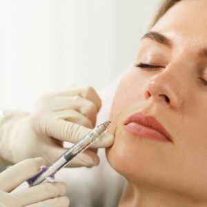 Female client during facial filler injections Hair Filler - Sci-u Training Academy